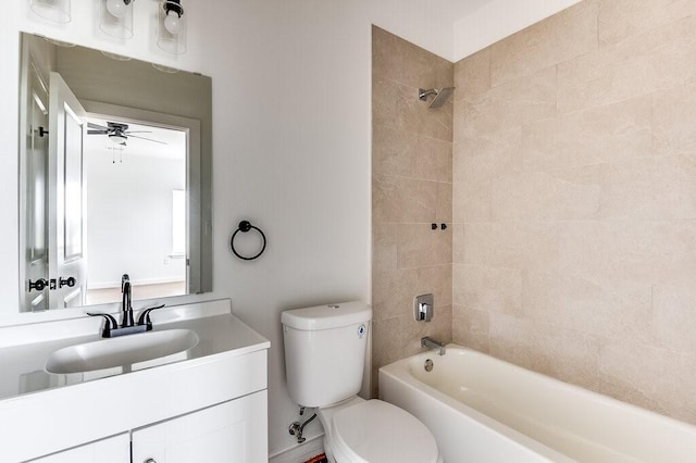 full bathroom featuring tiled shower / bath combo, ceiling fan, toilet, and vanity