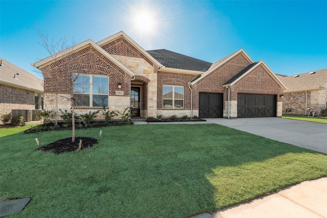 view of front facade with a garage and a front yard