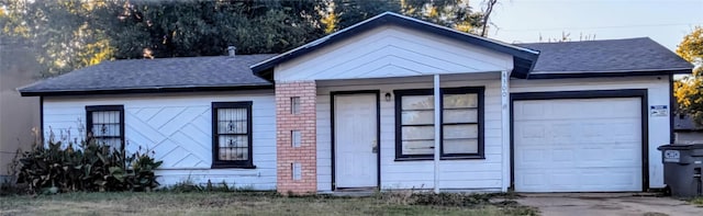 ranch-style home with a garage