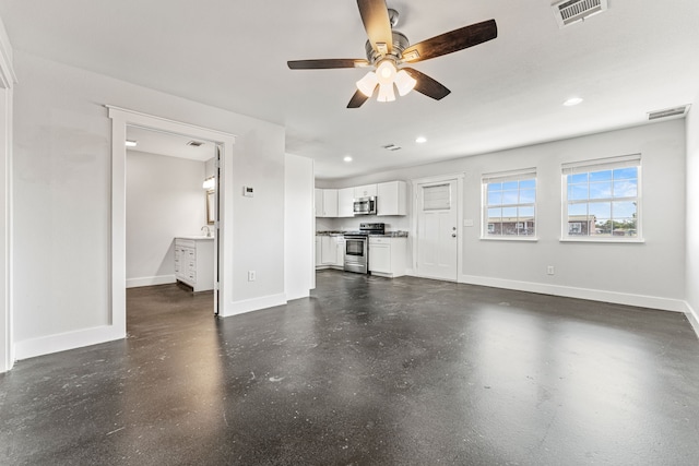 unfurnished living room with ceiling fan