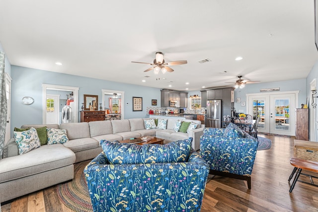 living room featuring ceiling fan, french doors, and hardwood / wood-style flooring