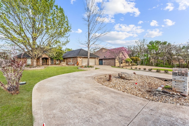 ranch-style house featuring a front yard and a garage