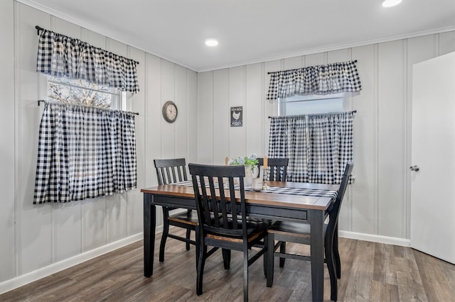 dining space with wood-type flooring