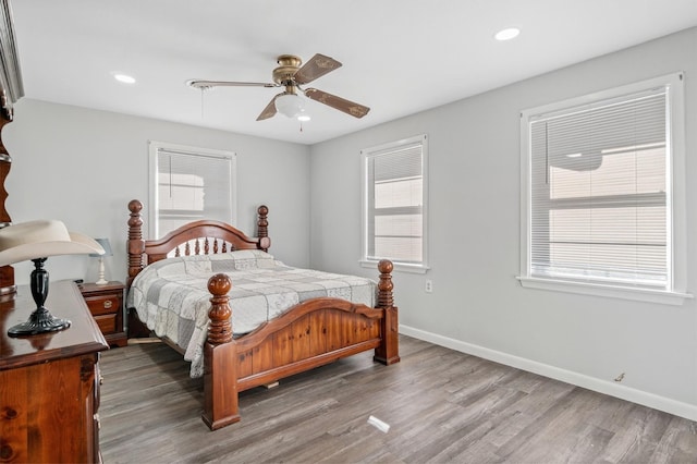 bedroom with hardwood / wood-style flooring and ceiling fan