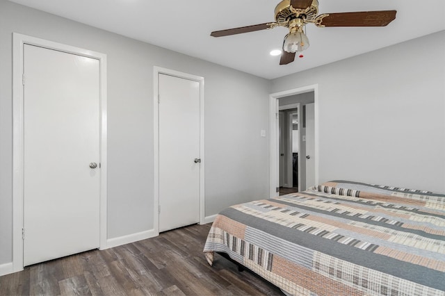 bedroom featuring ceiling fan and dark wood-type flooring