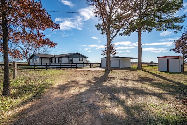 view of yard featuring a storage unit