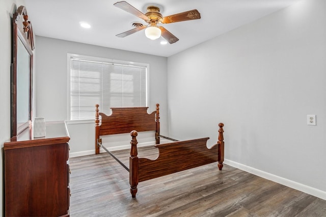 bedroom with ceiling fan and wood-type flooring