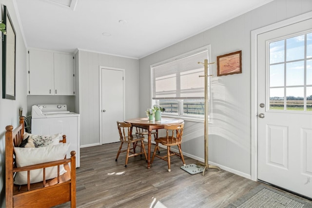 dining area with hardwood / wood-style floors and washer / clothes dryer