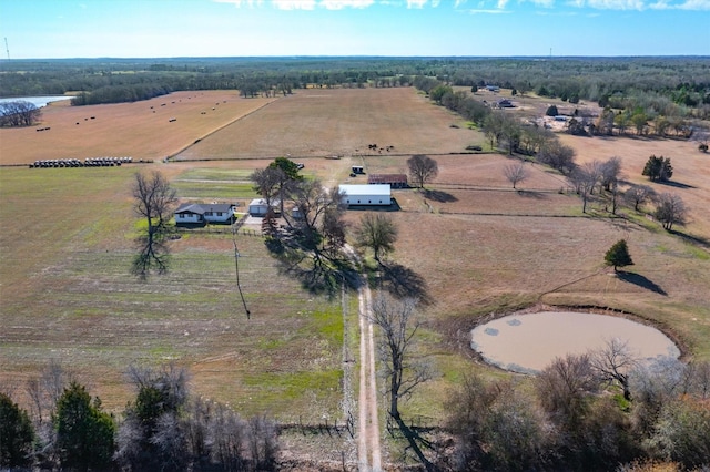 birds eye view of property with a water view and a rural view