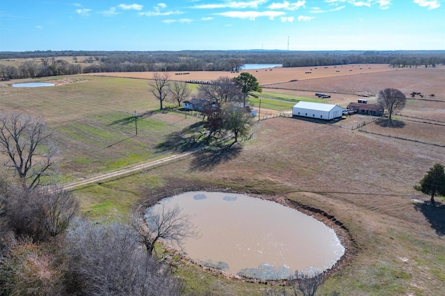 birds eye view of property with a rural view and a water view