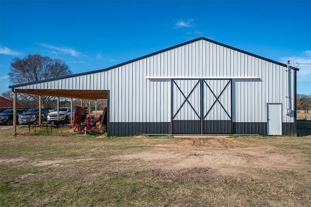 view of outbuilding featuring a carport