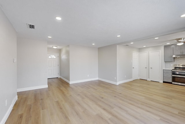 unfurnished living room with light wood-type flooring