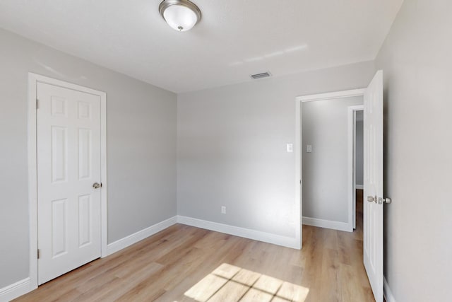 spare room with light wood-type flooring