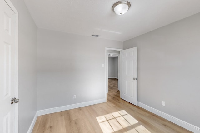 unfurnished room featuring light wood-type flooring