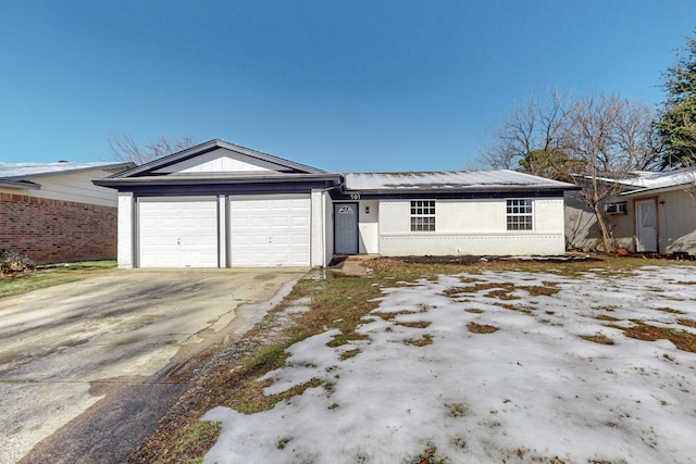 ranch-style house featuring a garage