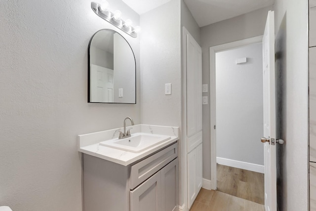 bathroom featuring hardwood / wood-style floors and vanity