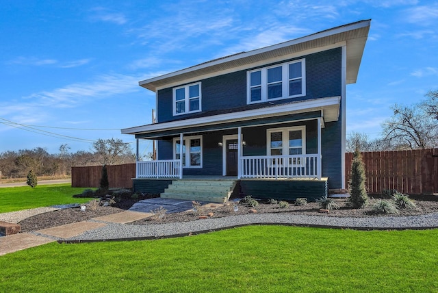 view of front of property featuring covered porch and a front lawn