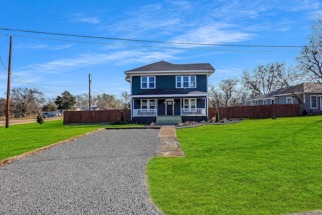 front of property featuring a front lawn and covered porch