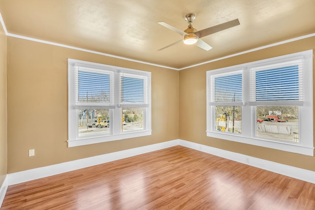 unfurnished room with ceiling fan, ornamental molding, hardwood / wood-style floors, and a textured ceiling