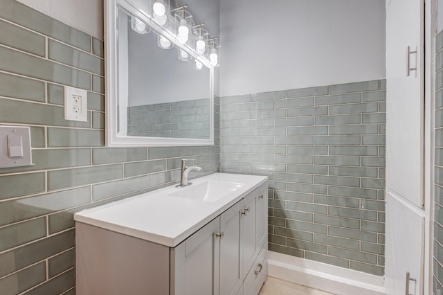 bathroom featuring tile walls and vanity