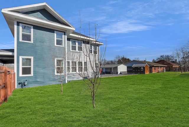 back of house featuring a yard