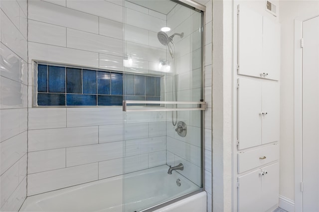 bathroom featuring enclosed tub / shower combo