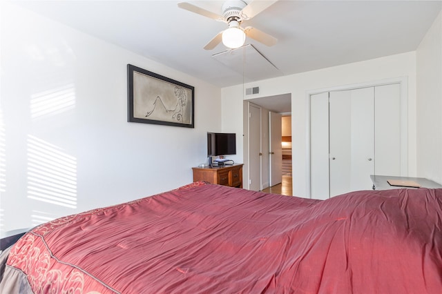 bedroom featuring ceiling fan and a closet