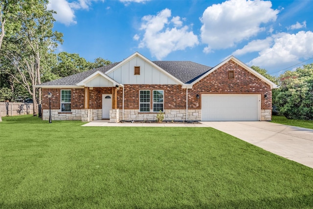 view of front of home with a front yard and a garage