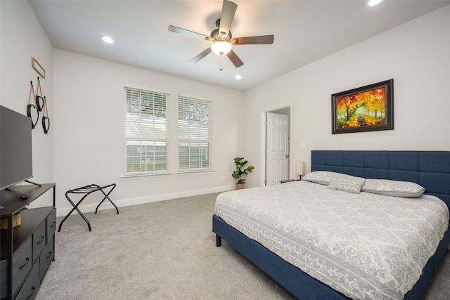 bedroom featuring ceiling fan and carpet