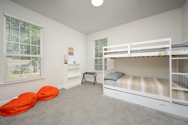 carpeted bedroom with vaulted ceiling