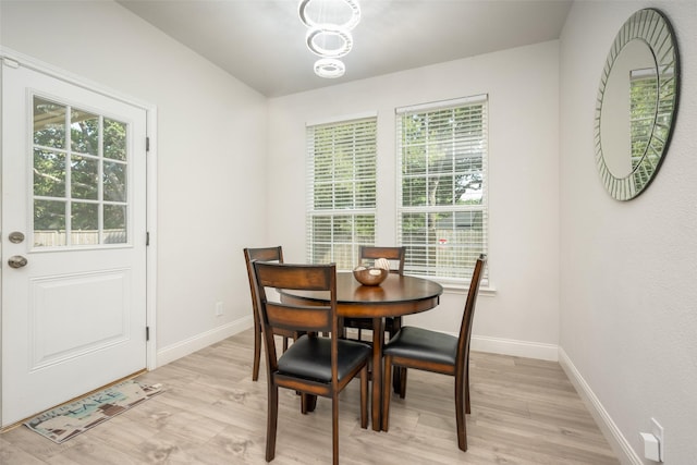 dining space featuring light hardwood / wood-style flooring and a healthy amount of sunlight