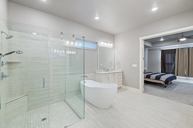 bathroom with ceiling fan, vanity, and shower with separate bathtub