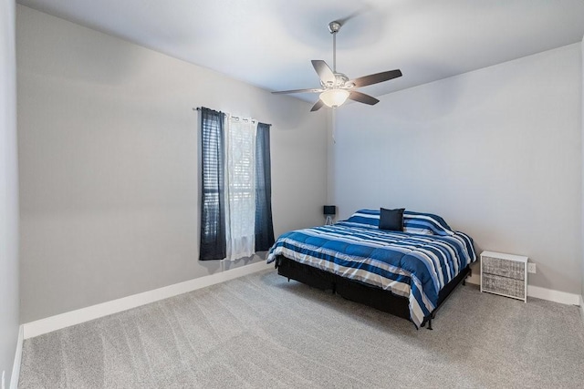 bedroom featuring ceiling fan and carpet