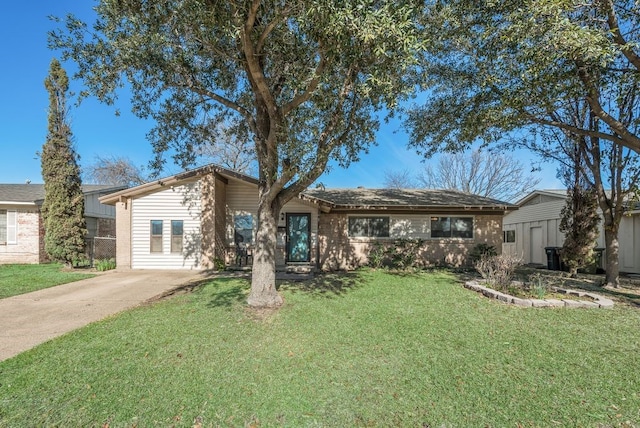 single story home with a front yard