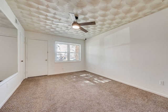 unfurnished bedroom with carpet flooring and ceiling fan