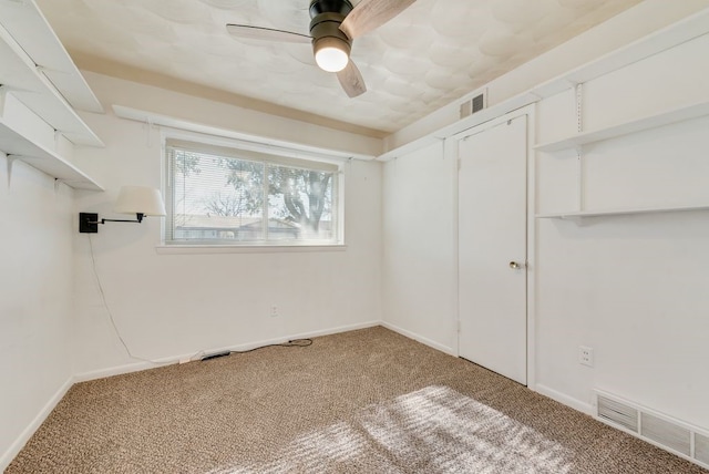 interior space featuring ceiling fan