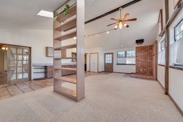 carpeted living room featuring a textured ceiling and ceiling fan