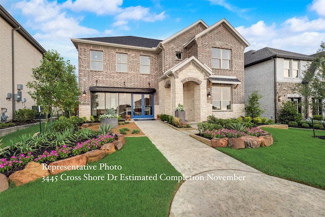 view of front facade with a front lawn and french doors