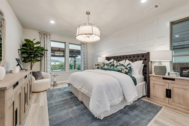 bedroom with hardwood / wood-style flooring