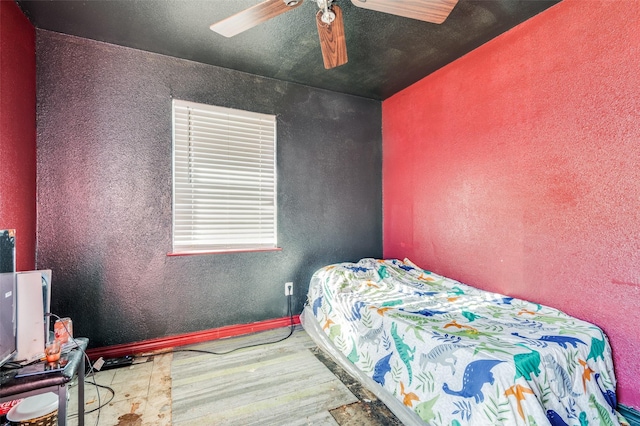 bedroom with light wood-type flooring and ceiling fan