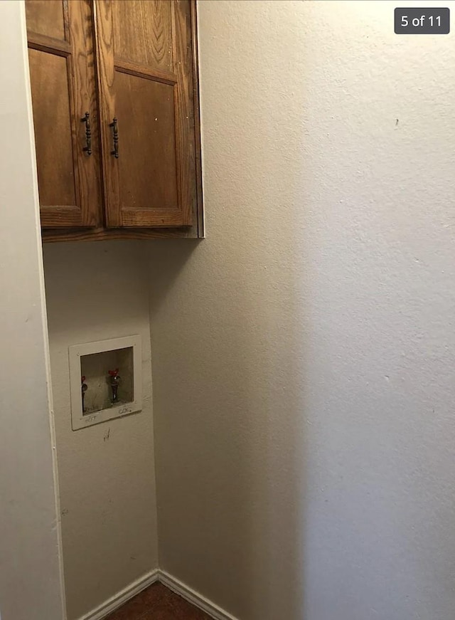 washroom featuring cabinets and hookup for a washing machine