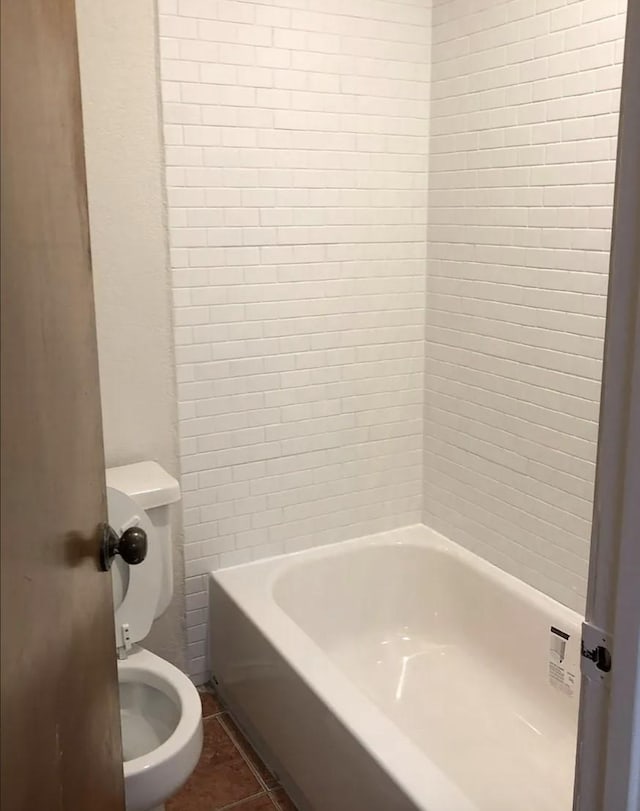 bathroom with tile patterned floors and toilet