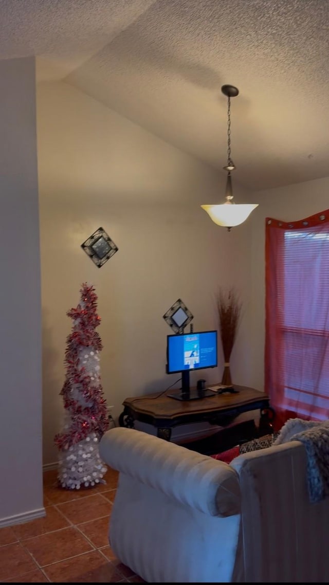 tiled living room featuring a textured ceiling and lofted ceiling