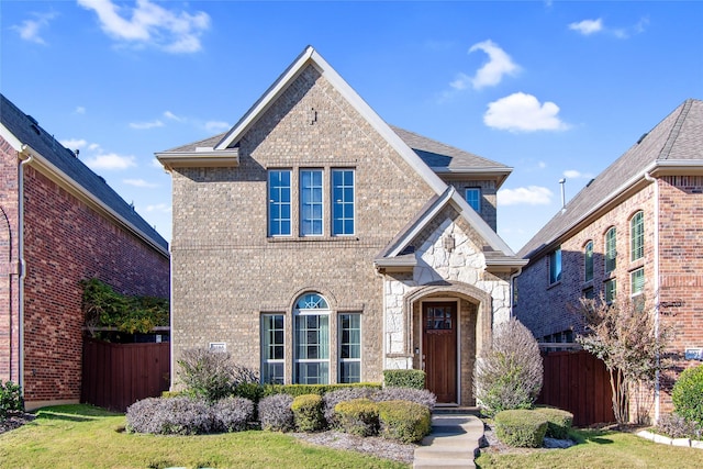 front facade with a front lawn