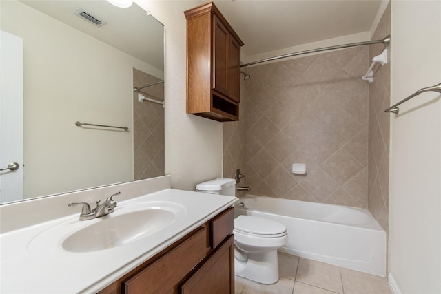 full bathroom with tile patterned flooring, vanity, toilet, and tiled shower / bath