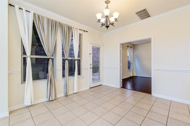 kitchen with backsplash, crown molding, black appliances, light tile patterned floors, and white cabinets