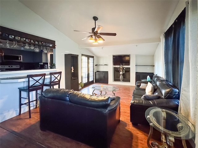 living room featuring french doors, ceiling fan, hardwood / wood-style floors, and lofted ceiling