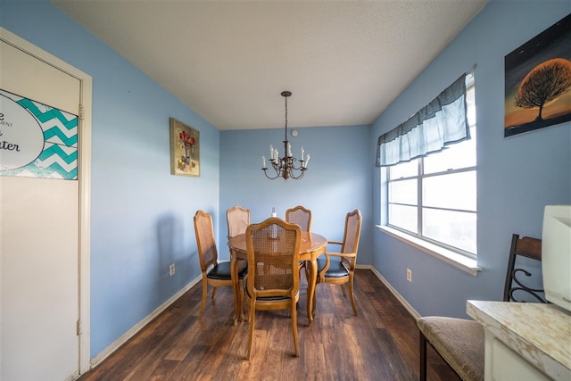 dining area featuring dark hardwood / wood-style floors and a notable chandelier