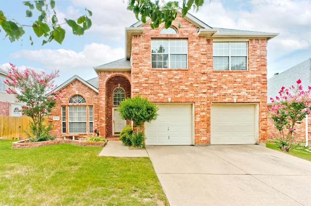 front of property with a garage and a front lawn