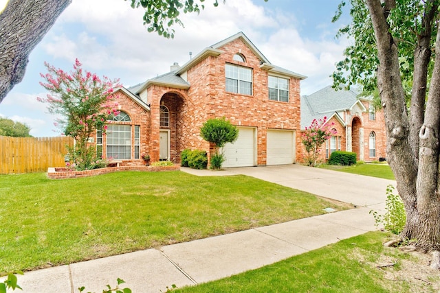 view of front of house featuring a front lawn and a garage